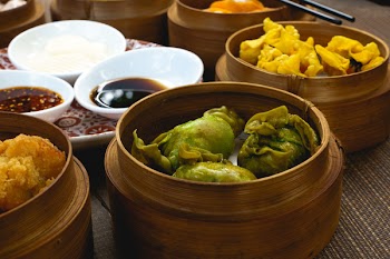 Chinese fried dim sum in wooden steamers 