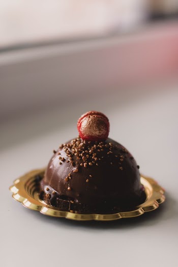 Chocolate Cake in Gold-colored Saucer