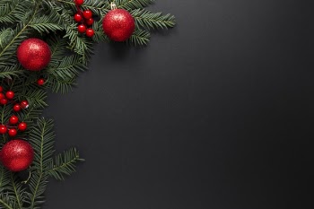 Christmas decorations on black background with copy space Free Photo