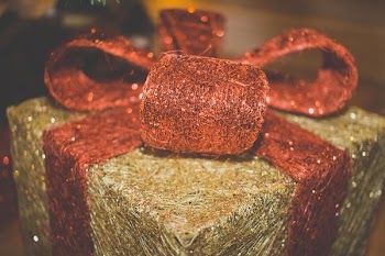          Christmas Present With Red Bow Free Photo     