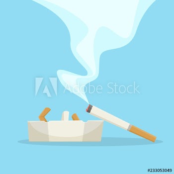 Cigarette with smoke lying on the ashtray