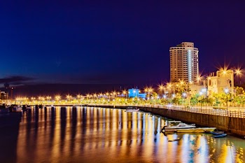 City Beside Body of Water at Night With Lights Landscape Photography