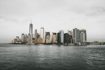 city buildings near body of water during daytime