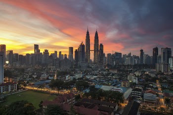 City Buildings Under Orange Sunset
