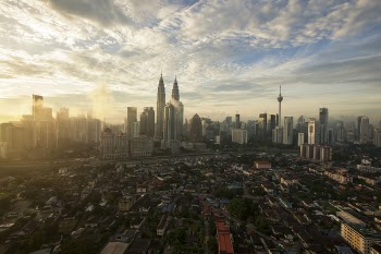 City High Under Cloudy Sky during Daytime