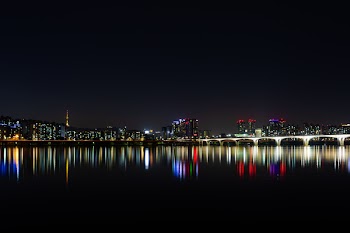 City Near Bodies of Water during Night Time