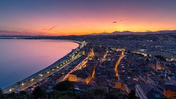 Cityscape and Body of Water during Sunset