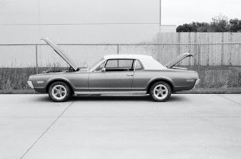 Classic Mercury Cougar American car in black and white.