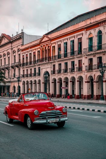 Classic Red Convertible On Road