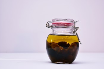 Clear Airtight Canister With Brown Liquid