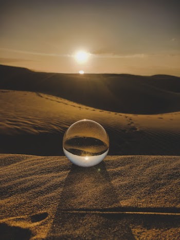Clear Ball on Brown Sand Dunes