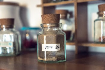 Clear Cork Bottle on Brown Wooden Table
