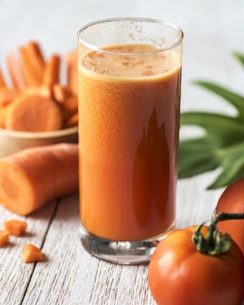 Clear Drinking Glass Filled With Carrot Juice