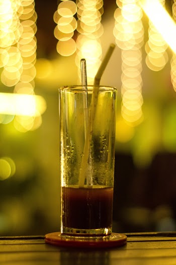 Clear Drinking Glass With Beverage and Straw