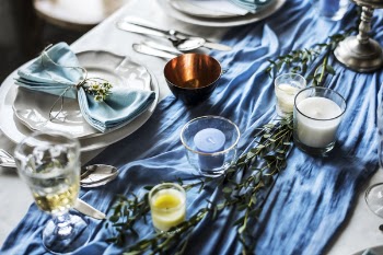 Clear Glass Candle Holders on the Blue Textile