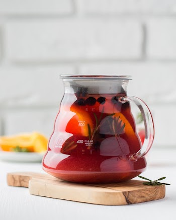 Clear Glass Container on Wooden Surface