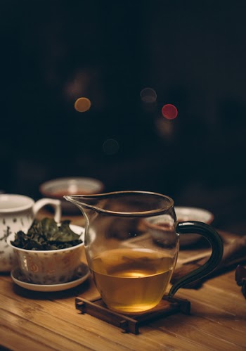 Clear Glass Cup on Brown Wooden Table