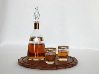 Clear Glass Decanter Beside Two Drinking Glasses