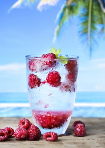 Clear Glass Filled With Raspberries