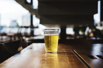 Clear Glass Filled With Yellow Liquid