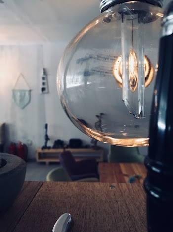 Clear Glass Lamp Near Brown Wooden Surface