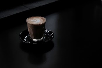 clear glass mug with coffee