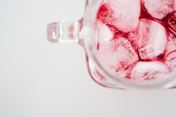 Clear Glass Mug With Ice and Red Liquid