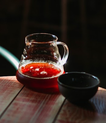 Clear Glass Pitcher Beside Bowl