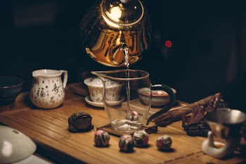 Clear Glass Pitcher on Brown Wooden Table