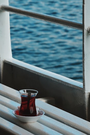 Clear Glass Turkish Teacup Beside Window