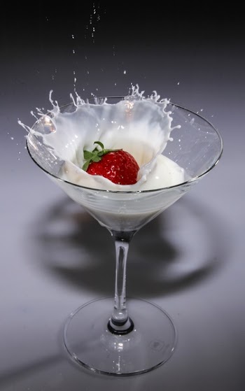 Clear Long Stem Wine Glass With Strawberry and White Liquid