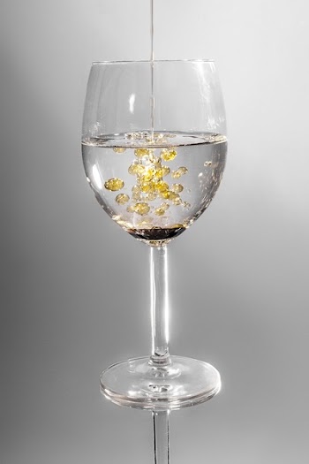 Clear Long Stem Wine Glass With Yellow Liquid