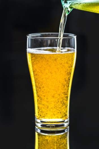 Clear Pint Glass Filled With Liquid