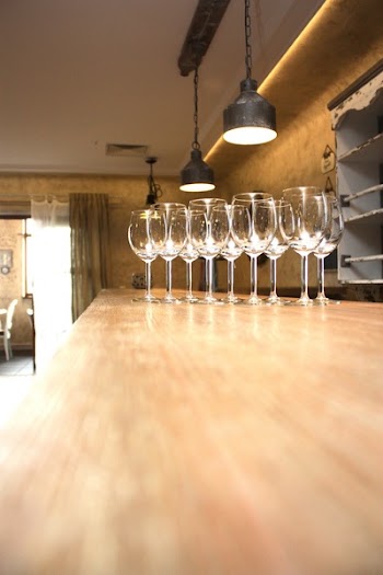 Clear Short Stem Wine Glass on Brown Wooden Table