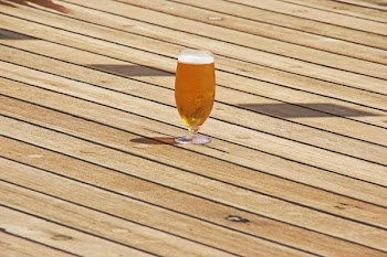 Clear Short-stem Wine Glass on Parquet Flooring