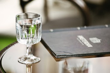 Clear Short-stemmed Glass Beside Menu