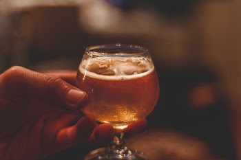 Clear Wine Glass Filled to the Brim