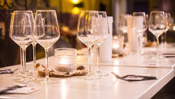 Clear Wine Glasses on White Wooden Table