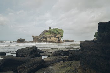 Cliff in Middle of Body of Water