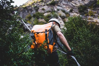 Climber Repelling A Mountain
