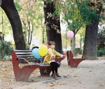 Close to my house there is this beautiful park garden. One day I was passing by and met this girl playing with her balloons. It was refreshing to see a child play outside with just some balloons in an era of technology.