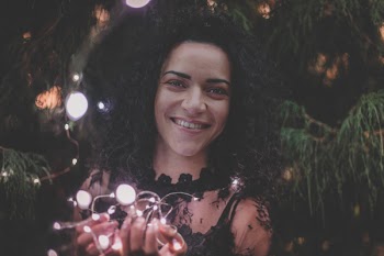 Close-U Photography of a Woman Holding String Lights