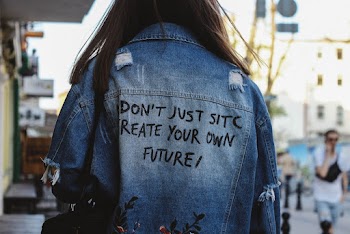 Close-up Back View Photo of Woman in Blue Denim Jacket