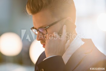 Close up corporate businessman talking on smart phone