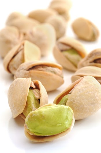 Close-up image of pistachios with white background