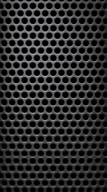 Close-Up Macro of Dark Perforated Metal Grille