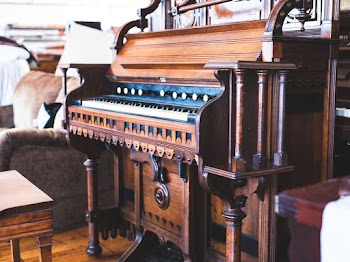 Close-up Of A Antique Brown Upright Piano