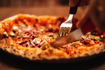 Close-up Of A Baked Pie Being Sliced