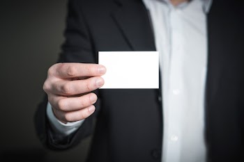 Close-up of a Person Hand With Card