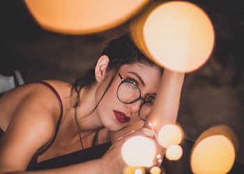 Close-up Of A Woman In Black Tank Top With Eyeglasses